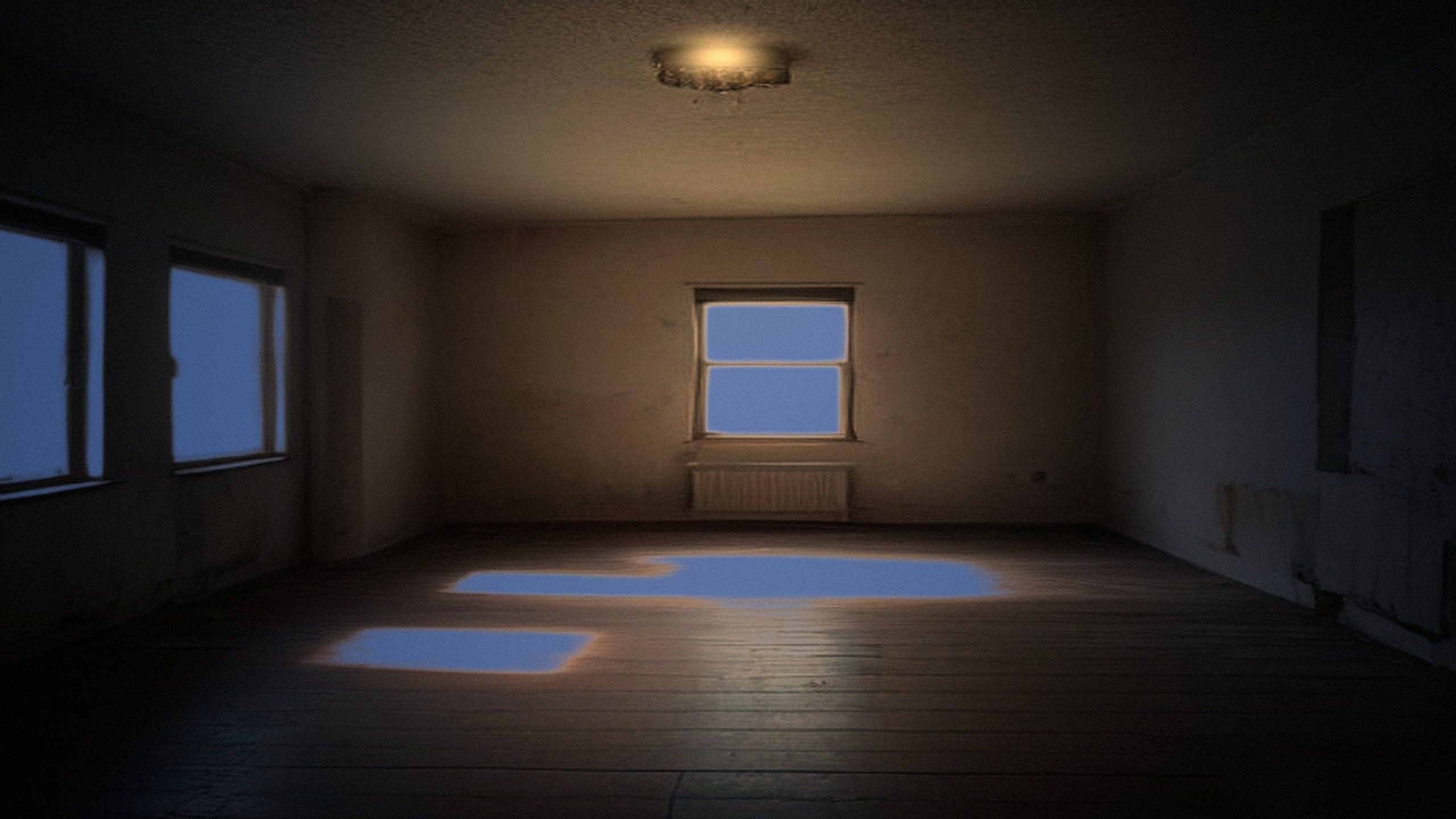 A bare room at night lit by one ceiling lamp